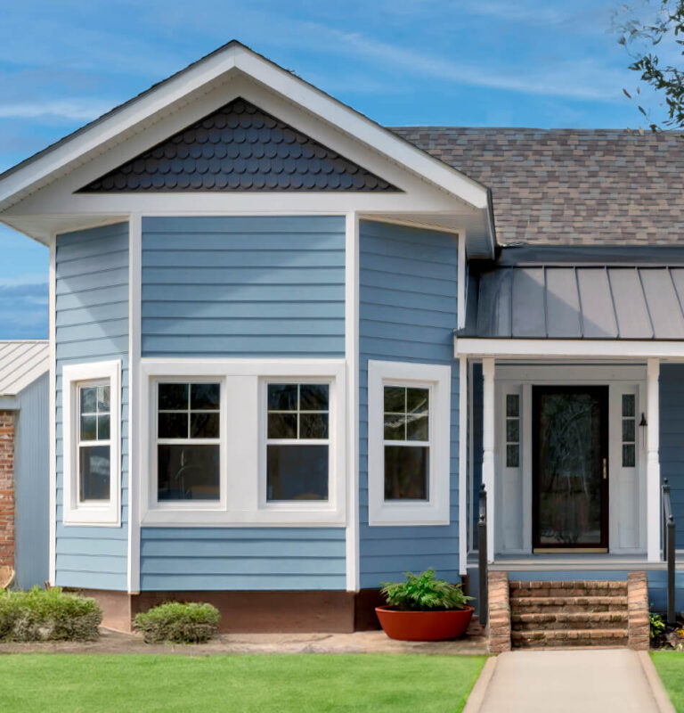 Blue ranch style house with double-hung windows