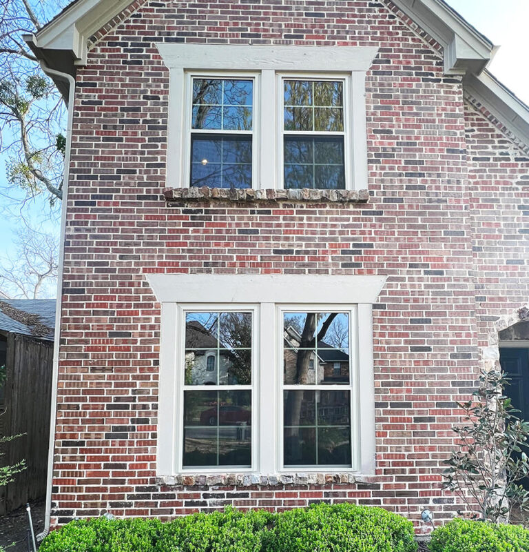 Front of brick house with double-hung windows