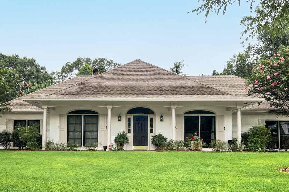 Photo of home exterior with black windows